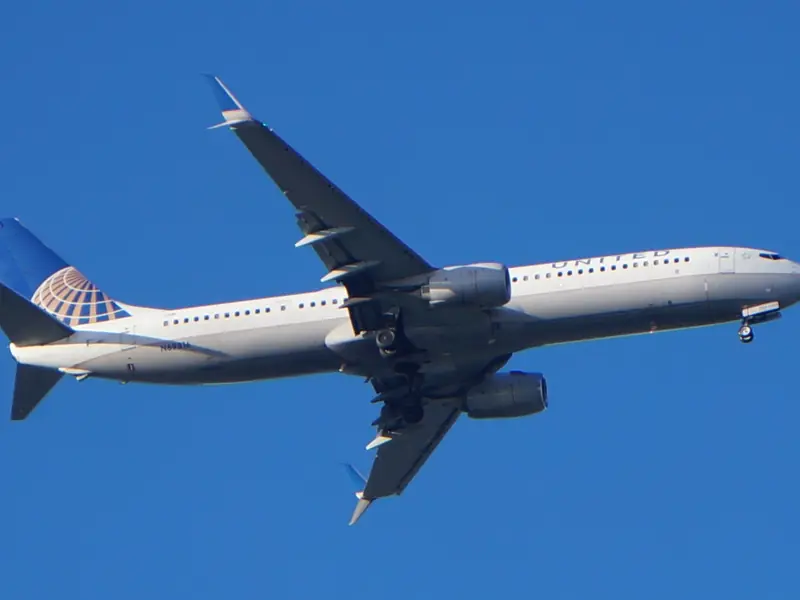 Passenger airliner flying in a clear blue sky