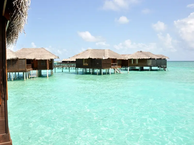 Overwater bungalows on a turquoise lagoon