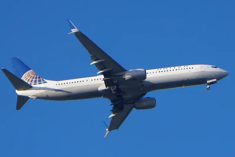 Passenger airliner climbing in a clear blue sky
