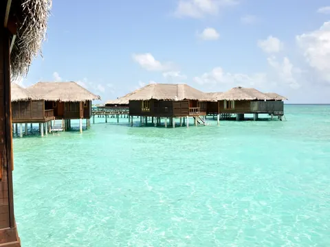 Overwater bungalows on a turquoise lagoon